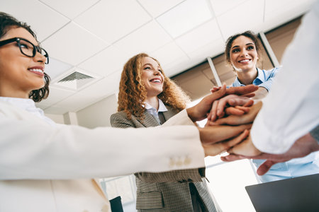 Diverse colleagues collaborating and showing teamwork in a professional office environment