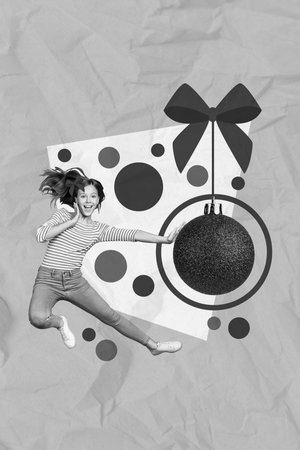 Vertical collage of excited funky black white gamma girl jumping hand touch big hanging bauble toy isolated on green backgroundの写真素材