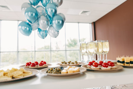 Elegant corporate gathering with appetizers and drinks against a bright office environment with blue...