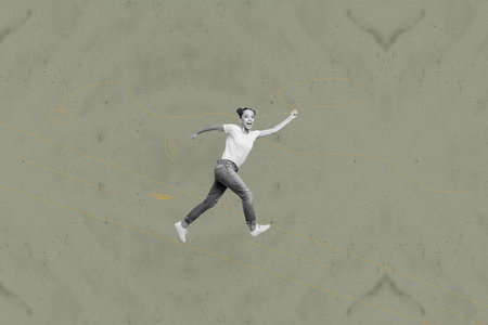 Collage of energetic person jumping with playful cartoon doodles in creative whimsical concept illustrationの写真素材