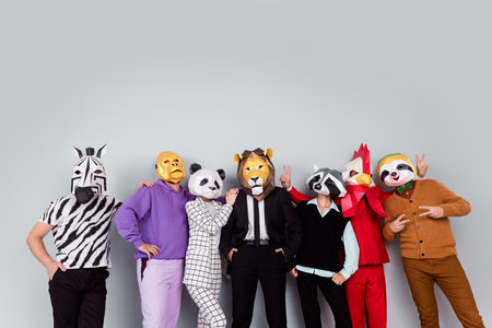 Photo of zebra gorilla raccoon lion panda sloth rooster mask people hug show v-sign isolated on grey color backgroundの写真素材