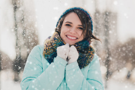 Photo of pretty cute young sweet woman wear scarf hat snow day winter weather in park outdoors outsideの写真素材