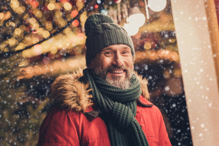 Portrait of satisfied peaceful person toothy beaming smile enjoy festive free time weekend outsideの写真素材