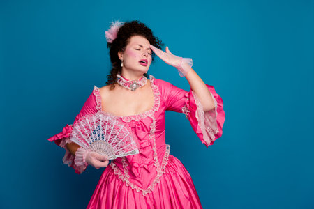 Photo of tired upset marie antoinette wear rich dress rising hand fan suffer migraine empty space...