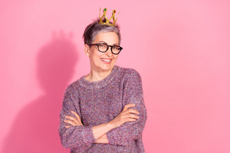 Photo of adorable lovely woman wear jumper crown arms folded empty space isolated pink color...