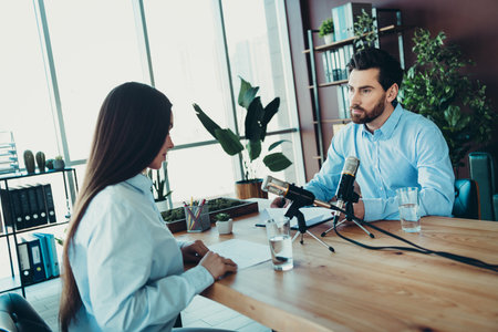 Workspace interview showcasing teamwork and business collaboration in a modern office environment with coworkersの写真素材