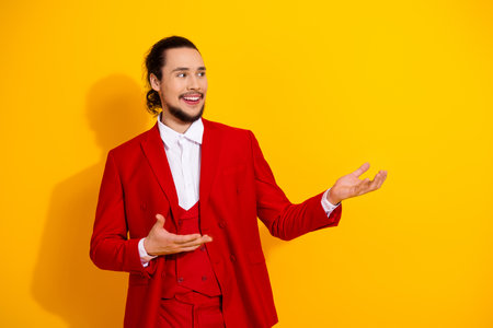 Hilarious red suited man on bright yellow background delivers bold fashion vibes and playful showmanship for stylish promoの写真素材