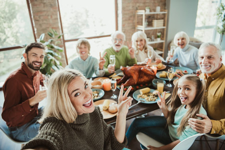 Funny family Thanksgiving feast with big table of food and joyful grandchildren and grandparents...