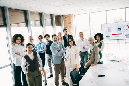 Diverse Professional Team Collaborating in a Modern Office Setting with Documents and Presentation...