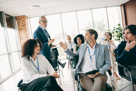 Diverse group of professionals engaging in a collaborative discussion at an office workshop setting