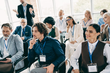 Diverse Businesspeople Attending an Educational Conference in a Modern Office Setting with Corporate Teamwork Atmosphereの写真素材