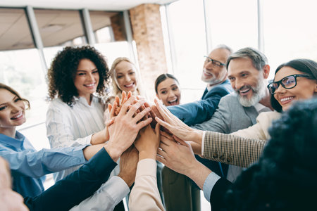 Focused Team of Diverse Professionals Collaborating in a Modern Office Reflecting Teamwork and...
