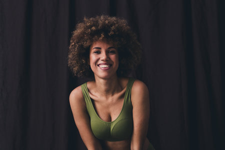 Photo of young lady toothy smile charming dressed khaki lingerie studio background no filter self acceptance all body perfectの写真素材