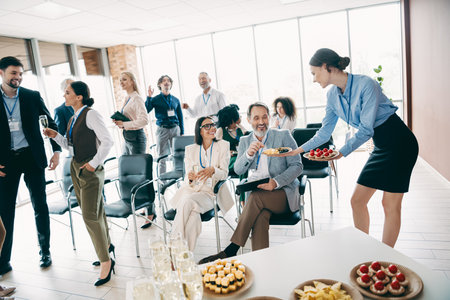 Professional office team enjoying a casual interactive business gathering focused on collaboration and teamwork dynamicsの写真素材