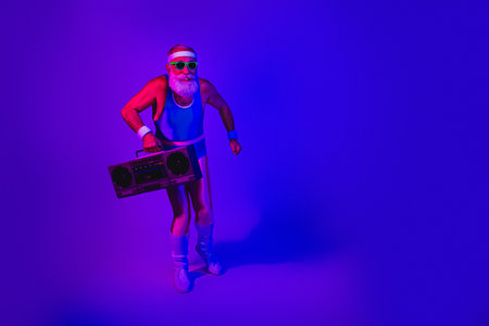 Retro fitness man with boombox in neon purple blue studio vibeの写真素材