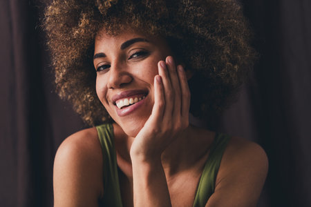 Photo of lovely young lady touch face soft skin dressed khaki lingerie studio background no filter self acceptance all body perfectの写真素材