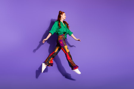 Full size photo of positive nice woman dressed vintage trousers jump look at discount empty space...