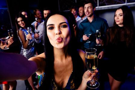 Playful night out with friends at a trendy club celebrating music laughter and champagne together