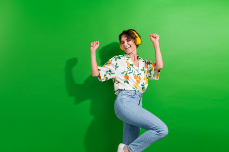 Photo of nice young girl stylish print fruit shirt dancing carefree raised fists up stereo...
