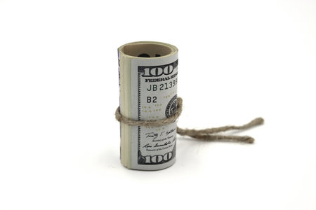 Money. Roll of dollars isolated on white background.の写真素材