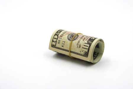 Money. Roll of dollars isolated on white background.