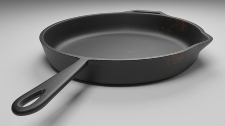 cast iron pan with a few rust spots isolated on white 3d illustrationの写真素材