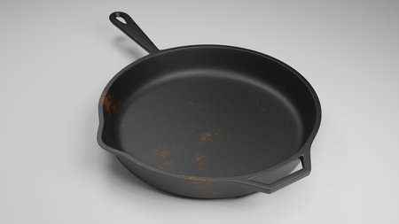 cast iron pan with a few rust spots isolated on white 3d illustrationの写真素材