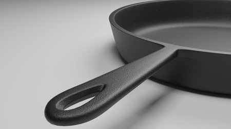 closeup of the handle of a cast iron skillet isolated on white 3d illustrationの写真素材