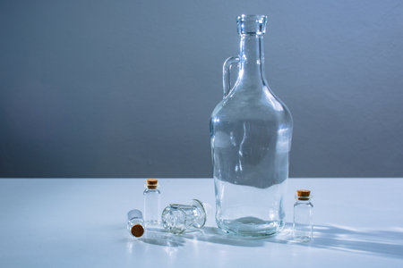 Empty the glass carafe and several glass beakers or test tubeの写真素材