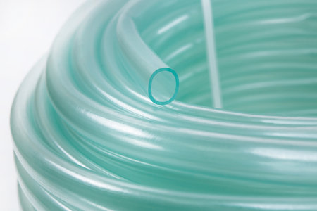 A rubber hose wrapped in a bobbin and fastened with a plastic lockの写真素材