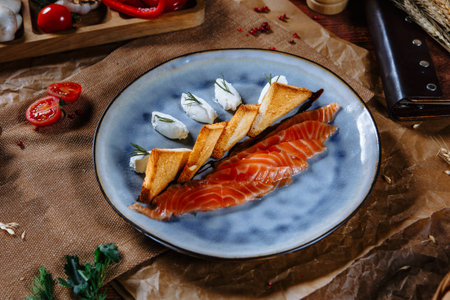 Red fish with fried bread and sour cream slices. top viewの写真素材