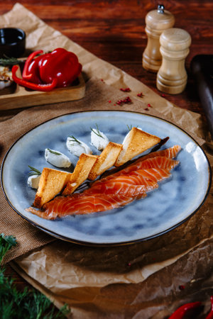 Red fish with fried bread and sour cream slices. top viewの写真素材