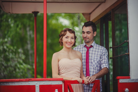 A guy and a girl in 60s clothes are standingの写真素材