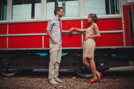 A guy and a girl in 60s clothes are standingの写真素材