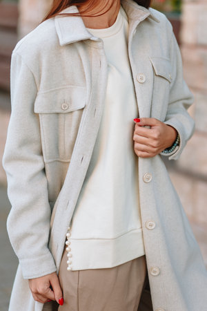 The girl is a model showing fashionable clothes on the street.の写真素材