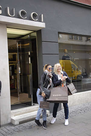 COPENHAGEN /DENMARK- Gucci shoppers with gucci shopping bags on stroget 26 JUNE 2014 COPENHAGEN /DENMARK- Gucci shoppers with gucci shopping bags on stroget 26 JUNE 2014