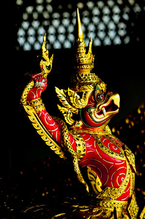 garuda fighting with naga wooden carved into thai royal barge prowの写真素材