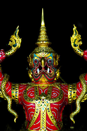 garuda fighting with naga wooden carved into thai royal barge prowの写真素材