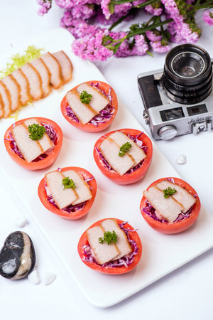 Tomato dessert & camera on deskのeditorial素材