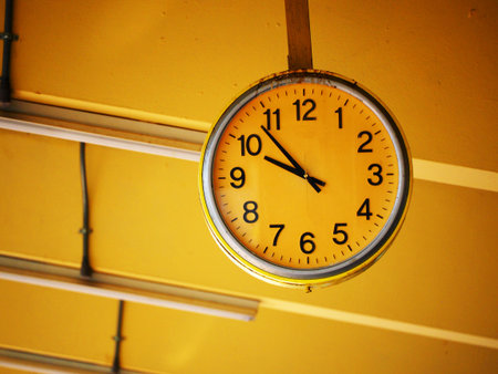 Public old clock In a railway stationの写真素材