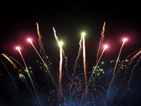 colored fireworks on black background, ideal for New Year, party or any celebration event