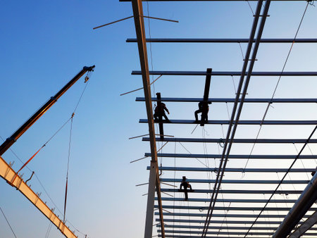 Man Working on the Working at height with blue skyの写真素材