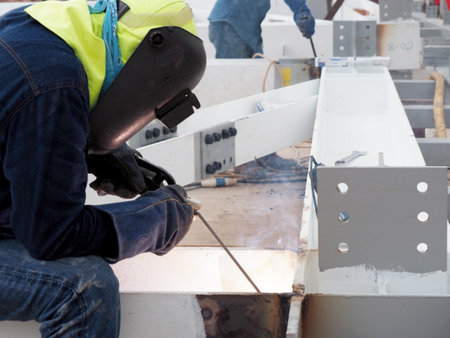 Welding work ,worker with protective welding metal on construction