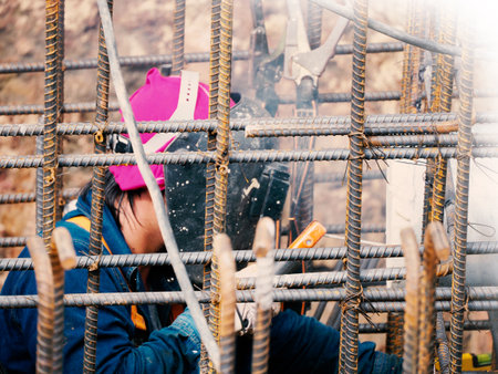 Welding work ,worker with protective welding metal on constructionの写真素材