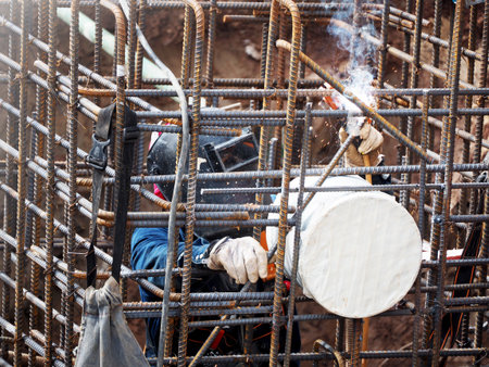 Welding work ,worker with protective welding metal on construction