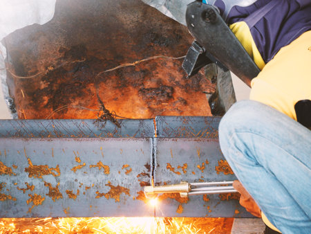 Welding work ,worker with protective welding metal on constructionの写真素材