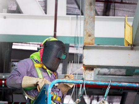 Welding work ,worker with protective welding metal on construction