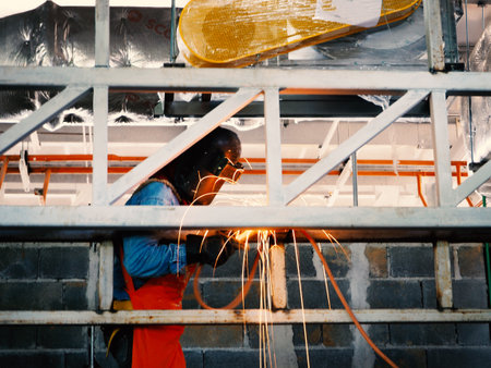 Welding work ,worker with protective welding metal on constructionの写真素材