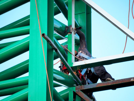 Welding work ,worker with protective welding metal on construction
