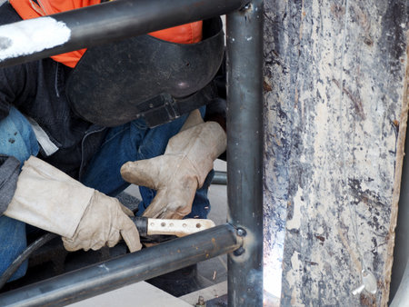 Welding work ,worker with protective welding metal on construction